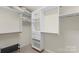 Walk-in closet featuring rods, shelves, and drawers at 4278 Park South Station Blvd, Charlotte, NC 28210