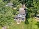 Aerial view of a waterfront home with a large deck overlooking lush greenery and the lake at 4586 Doctor Dr, Catawba, NC 28609