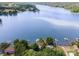 Expansive aerial view of lakefront property with private docks surrounded by lush greenery and serene blue waters at 4586 Doctor Dr, Catawba, NC 28609