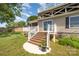 Exterior view of home with stone foundation, stairs leading to a private patio, and fenced yard at 4586 Doctor Dr, Catawba, NC 28609