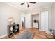 Bedroom with hardwood floors, a ceiling fan, and a view into another room with natural light at 4586 Doctor Dr, Catawba, NC 28609