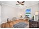 Bedroom with scenic lake view through a bright window, complemented by hardwood floors at 4586 Doctor Dr, Catawba, NC 28609