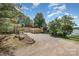 Extensive gravel driveway offering ample parking space, set amidst lush greenery and mature trees at 4586 Doctor Dr, Catawba, NC 28609