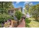 Landscaped yard with a stone chimney leads up to this lake home with mature trees at 4586 Doctor Dr, Catawba, NC 28609
