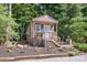 Charming small cabin with a covered porch, steps and landscaped garden, offering a cozy retreat at 4586 Doctor Dr, Catawba, NC 28609