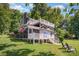 Charming lake house features a covered porch, upper deck, and lush green lawn at 4586 Doctor Dr, Catawba, NC 28609