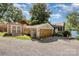 Lakeside property with a detached garage, shed, and well-maintained gravel driveway at 4586 Doctor Dr, Catawba, NC 28609