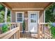 Charming front porch with wooden details, 'Welcome' sign, potted plants, and a cozy, inviting entrance at 4586 Doctor Dr, Catawba, NC 28609