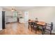 Open concept kitchen and dining area with stainless appliances, tile floors, and modern chairs with floral pattern cushions at 4586 Doctor Dr, Catawba, NC 28609