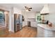 Modern kitchen with stainless steel appliances, white cabinets, granite countertops and wood-look flooring at 4586 Doctor Dr, Catawba, NC 28609