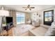 Bright living room with neutral paint, wood floors, a view of the lake and access to the deck at 4586 Doctor Dr, Catawba, NC 28609