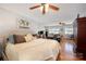 Spacious bedroom with a comfortable king-size bed, ceiling fan, natural light, and an ensuite living area at 4586 Doctor Dr, Catawba, NC 28609