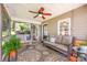 Relaxing covered porch with comfortable seating, ceiling fan, and views of the property at 4586 Doctor Dr, Catawba, NC 28609