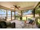 Cozy screened-in porch with comfortable seating overlooking the lake and lush greenery at 4586 Doctor Dr, Catawba, NC 28609