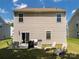 Exterior showcasing a cozy patio with a grill and lawn chairs at 461 Misty Law Ln, Clover, SC 29710