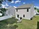 Expansive backyard featuring a patio, lounge chairs, and well-maintained lawn at 461 Misty Law Ln, Clover, SC 29710