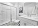 All-white bathroom features a glass door shower with built-in shelves and sink with modern vanity at 461 Misty Law Ln, Clover, SC 29710