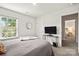 Cozy bedroom featuring a bed, and a view to an adjacent living space at 461 Misty Law Ln, Clover, SC 29710