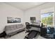 Well-lit bedroom with a futon, treadmill, and desk near a window at 461 Misty Law Ln, Clover, SC 29710