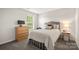 Comfortable bedroom with neutral decor, a large window, and carpeted flooring at 461 Misty Law Ln, Clover, SC 29710
