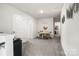 Bonus room with a table and chairs, and a sleek entertainment center at 461 Misty Law Ln, Clover, SC 29710