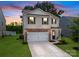 Inviting two-story home featuring a brick-accented facade and a well-maintained lawn at 461 Misty Law Ln, Clover, SC 29710