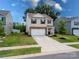 Charming two-story home with a well-manicured lawn and a spacious driveway in a Gathering-friendly neighborhood at 461 Misty Law Ln, Clover, SC 29710