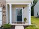 Inviting front entrance featuring a decorative glass door, manicured landscaping, and house number at 461 Misty Law Ln, Clover, SC 29710