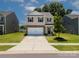 A well-maintained two-story home with a brick-accented garage and a clean, inviting front yard at 461 Misty Law Ln, Clover, SC 29710