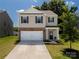 Charming two-story house with neutral siding, dark shutters, and a manicured lawn and landscaping at 461 Misty Law Ln, Clover, SC 29710