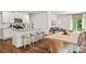 Modern kitchen with an island and seating open to the dining and living spaces at 461 Misty Law Ln, Clover, SC 29710