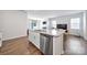 Kitchen island features a granite countertop with stainless steel dishwasher and sink, and is open to the living area at 461 Misty Law Ln, Clover, SC 29710