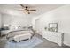 Bright main bedroom with neutral decor including a dresser and a cushioned bench by the bed at 461 Misty Law Ln, Clover, SC 29710