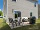 View of a backyard patio featuring a dining table and grill at 461 Misty Law Ln, Clover, SC 29710