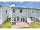 Back of home features a wooden deck, sliding glass door, and fenced yard at 502 Tayberry Ln, Fort Mill, SC 29715