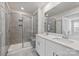 Modern bathroom with double vanity, grey tiled shower, and neutral color palette at 502 Tayberry Ln, Fort Mill, SC 29715