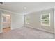 Bedroom featuring neutral carpet and access to the ensuite bathroom at 502 Tayberry Ln, Fort Mill, SC 29715