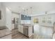 Modern kitchen with granite counters, stainless steel appliances, island with seating open to the living area at 502 Tayberry Ln, Fort Mill, SC 29715