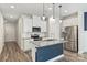 New kitchen featuring granite counters, stainless steel appliances, a kitchen island, and white cabinetry at 502 Tayberry Ln, Fort Mill, SC 29715