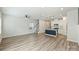 Open floor plan with hardwood floors, and a combined living, dining, and kitchen area at 502 Tayberry Ln, Fort Mill, SC 29715