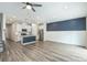 Open floor plan with hardwood floors, and a combined living, dining, and kitchen area at 502 Tayberry Ln, Fort Mill, SC 29715