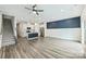 Open floor plan with hardwood floors, and a combined living, dining, and kitchen area at 502 Tayberry Ln, Fort Mill, SC 29715
