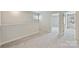 Neutral loft area with carpet, white walls, and natural light from windows at 502 Tayberry Ln, Fort Mill, SC 29715