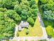 Breathtaking aerial view of property featuring lush greenery, mature trees, and a serene neighborhood at 511 Brookwood Dr, Statesville, NC 28677