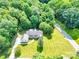 Stunning aerial view of home with lush greenery and swimming pool in the backyard at 511 Brookwood Dr, Statesville, NC 28677