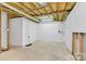 Spacious unfinished basement with concrete floor, exposed ceiling, and white block walls ready for customization at 511 Brookwood Dr, Statesville, NC 28677