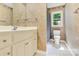 Bathroom featuring vanity with storage, a view of the shower with curtain and toilet at 511 Brookwood Dr, Statesville, NC 28677