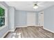 Bedroom with wood-look floors, closet, neutral paint, and a ceiling fan at 511 Brookwood Dr, Statesville, NC 28677