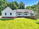 Charming single-Gathering home with brick accents and lush green lawn at 511 Brookwood Dr, Statesville, NC 28677