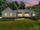 Charming single Gathering home features a landscaped lawn, brick accents, and large windows that bring in natural light at 511 Brookwood Dr, Statesville, NC 28677